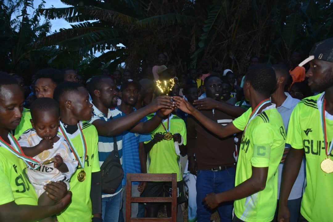 Young athletes celebrating unity and peace with a trophy 1